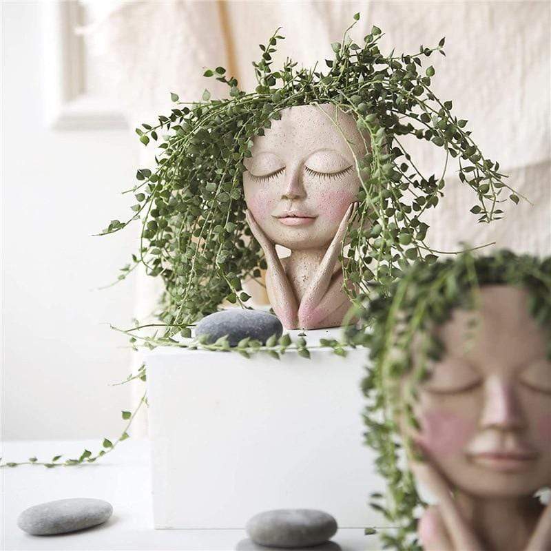 Unik ansikts-blomsterpotte i hvit resin, ideell for grønne planter og en leken hjemmedekorasjon.