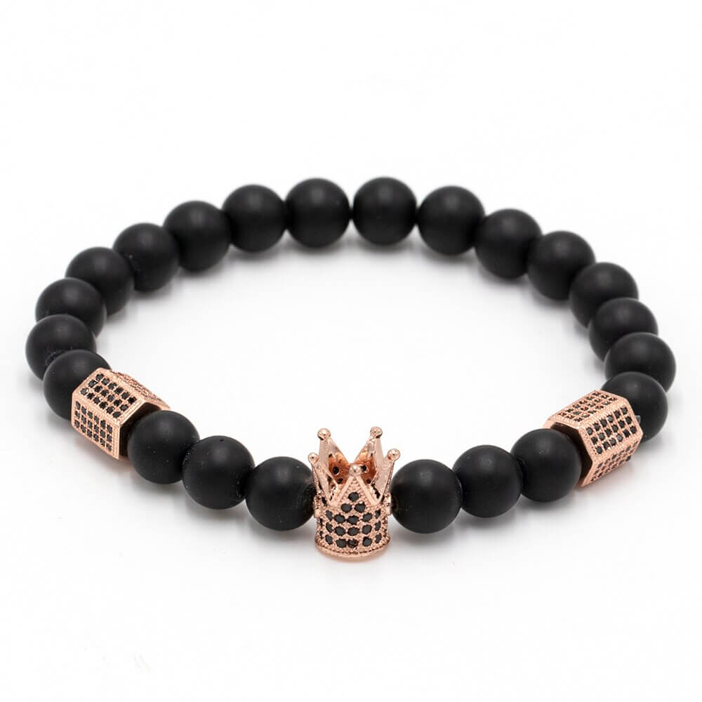 Ekte onyks steinarmbånd med kraftfulle hodeskalle- og elegante krone-detaljer. Unisex smykke for balanse.