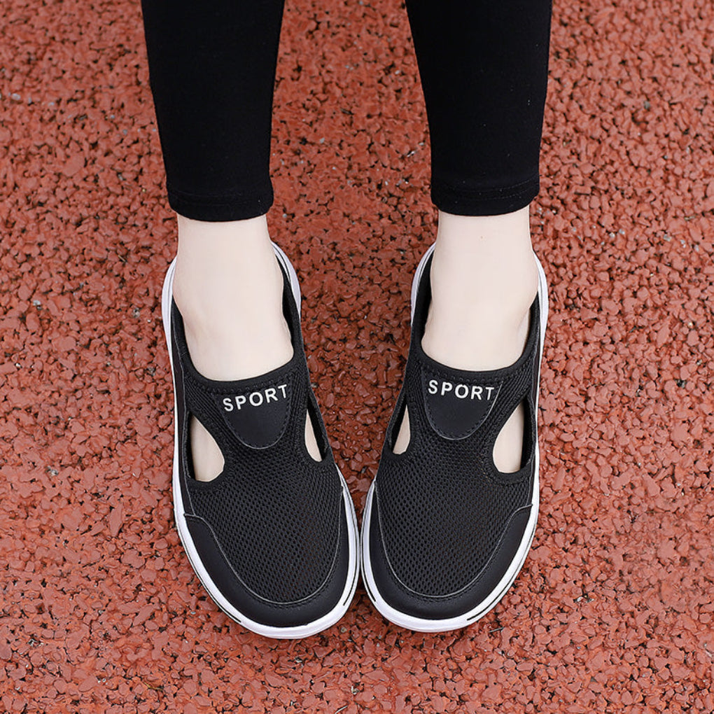 Svarte unisex slip-on ortopediske husklær, ideelle hjemmesko for komfort og avlastning med god fotstøtte.