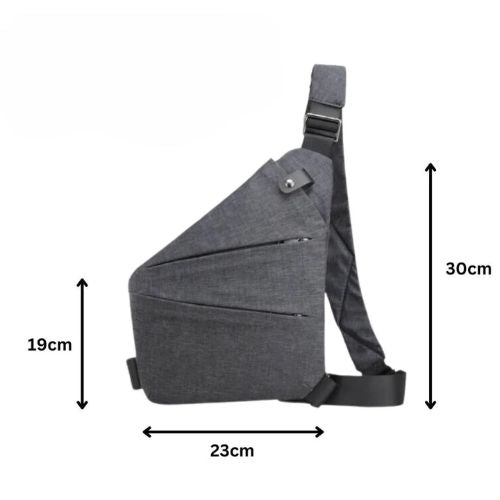 Tyverisikker skulderveske liggende på bord, klar for reise eller daglig bruk, unisex modell.