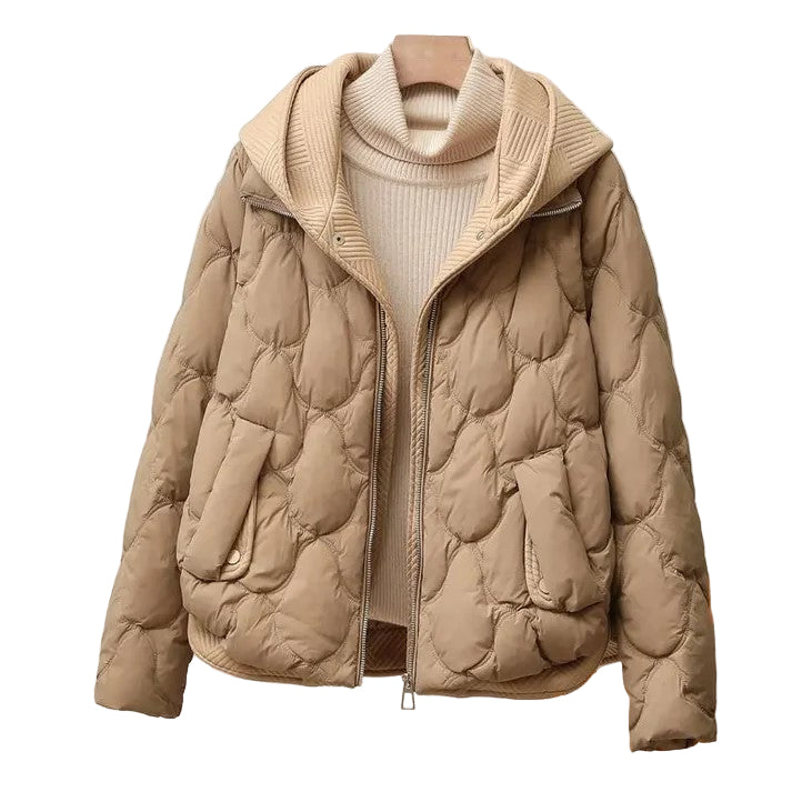 Varm og stilig dame pufferjakke i svart med kviltet design og høy krage, perfekt for vinter og høst.