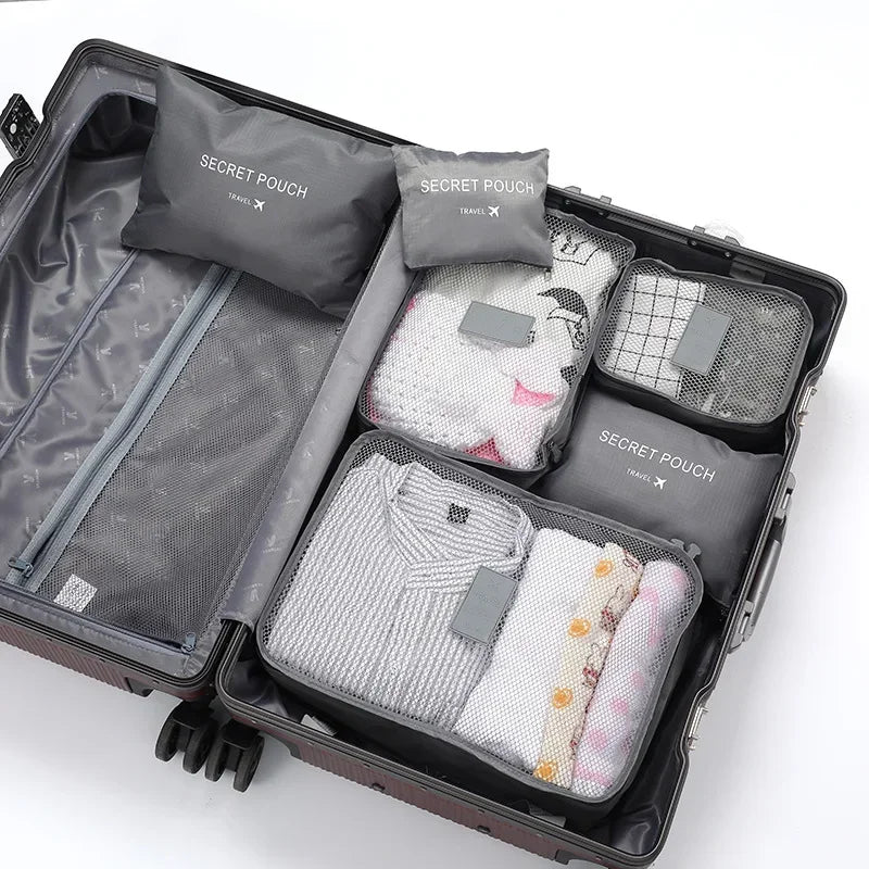 "6-teiliges wasserfestes Kofferorganizer Set, variabel in Größe, aus robustem Oxford-Stoff, ideal für Reisen."