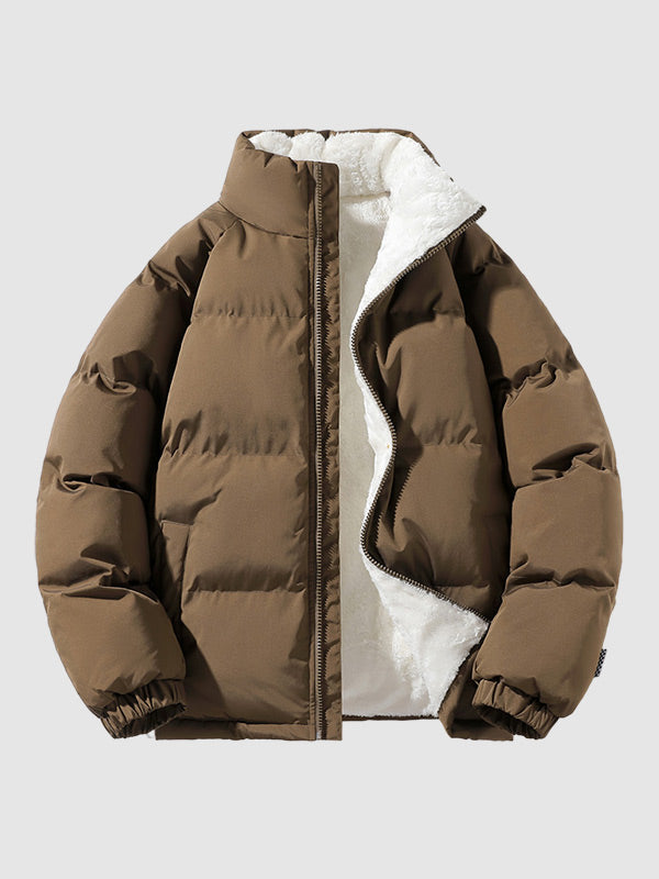 Braune Damen Pufferjacke mit gestepptem Design und Fleecefutter, winterwarm, Vorderansicht auf hellem Hintergrund.