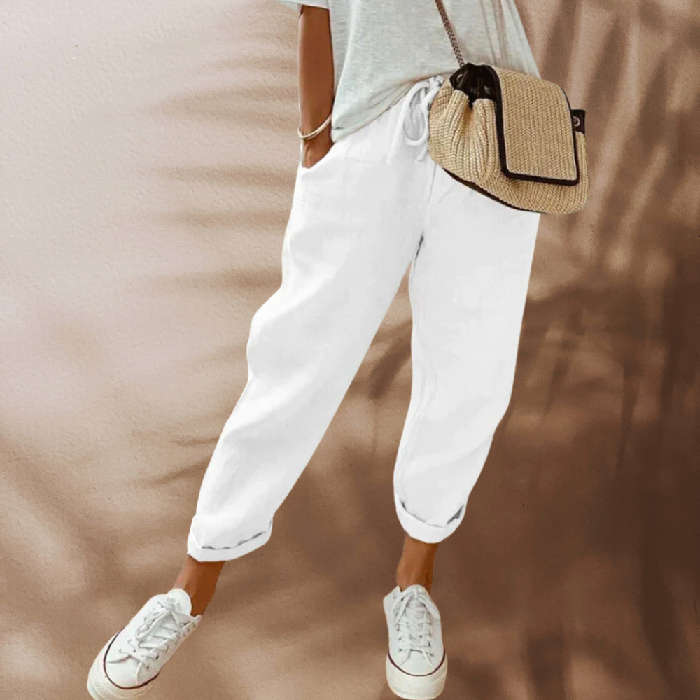 "Lässige Leinenhose in Beige, leichtes Material, Seitenansicht, ideal für Komfort und Stil, verschiedene Farben verfügbar"