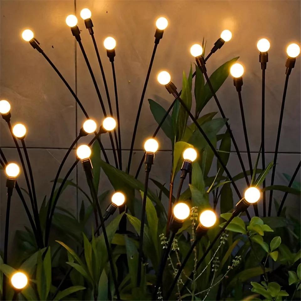 "Solarbetriebene Glühwürmchen Gartenlichter, umweltfreundlich, warmes Licht, flexible Stiele, ideal für Außenbereiche."