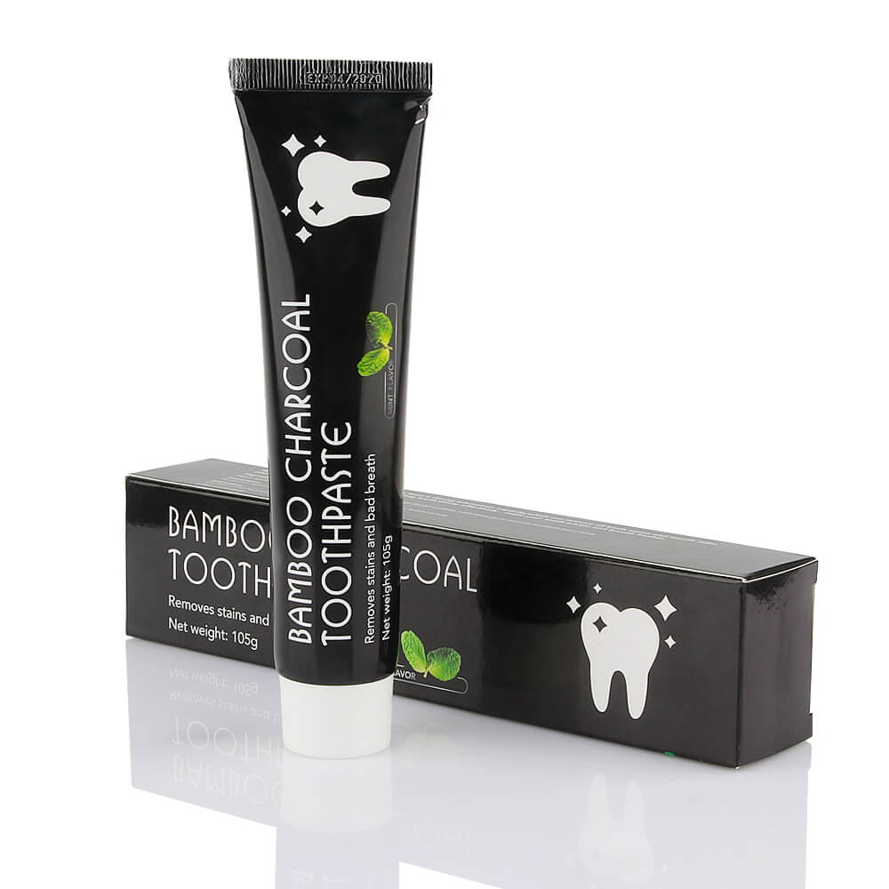 Aktivkohle tannkrem tube med bambuskull for naturlig tannbleking, 100ml, isolert på hvit bakgrunn