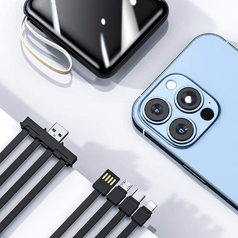 Praktisk strømbank 20000mAh med integrerte ladekabler for universell kompatibilitet.