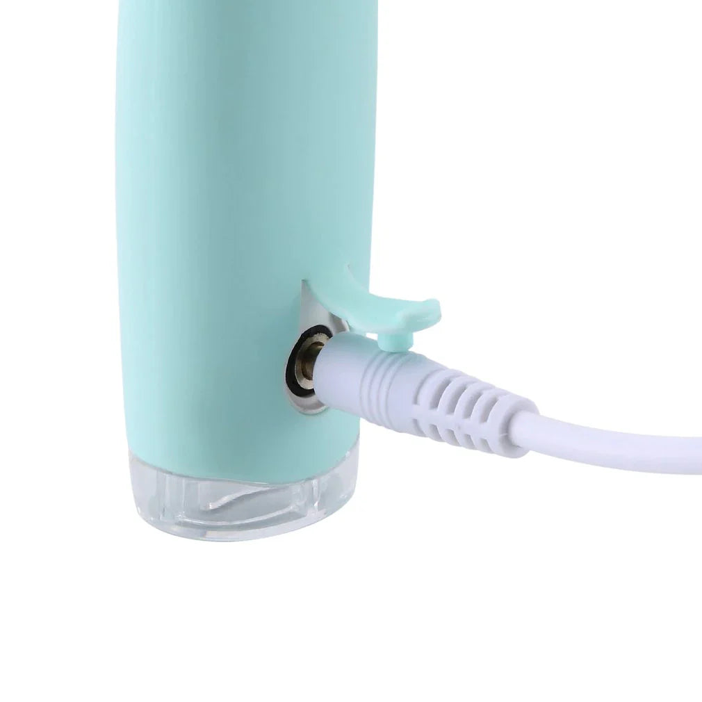 Kompakt reisevennlig ultrasonisk tannrenser, perfekt for munnhygiene og hvite tenner på farten.