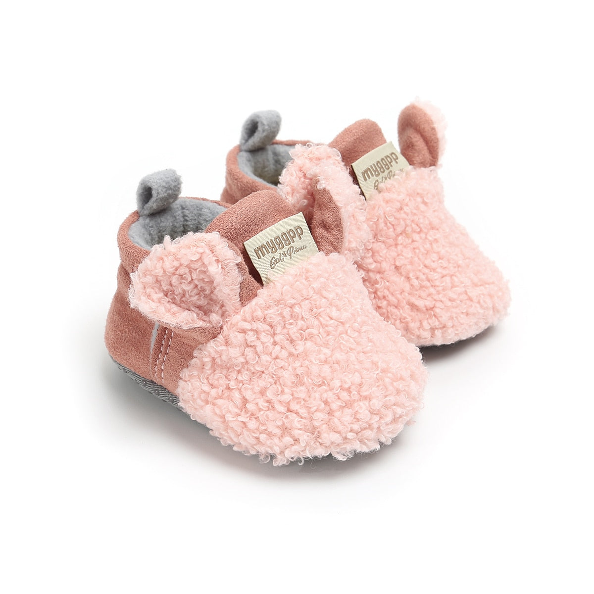 Detaljvisning: Babysko hvit, lamme-design, broderte ansiktstrekk, ideell for småbarn