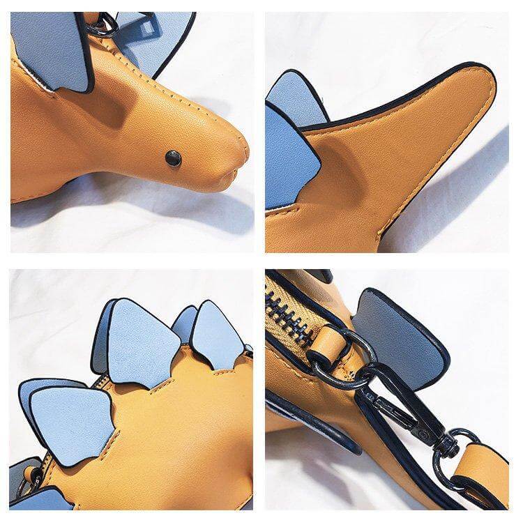 Nærbilde av den unike 3D Stegosaurus-designen på barnas grønne crossbody-veske.