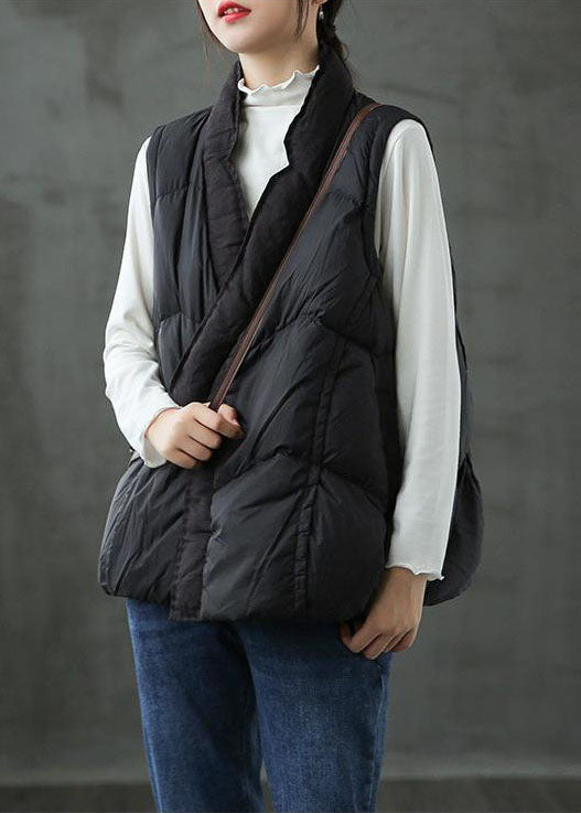 Romslig beige puffer vest til dame. Varm og stilig lagpålag-vest for kaldere dager og utendørs komfort.