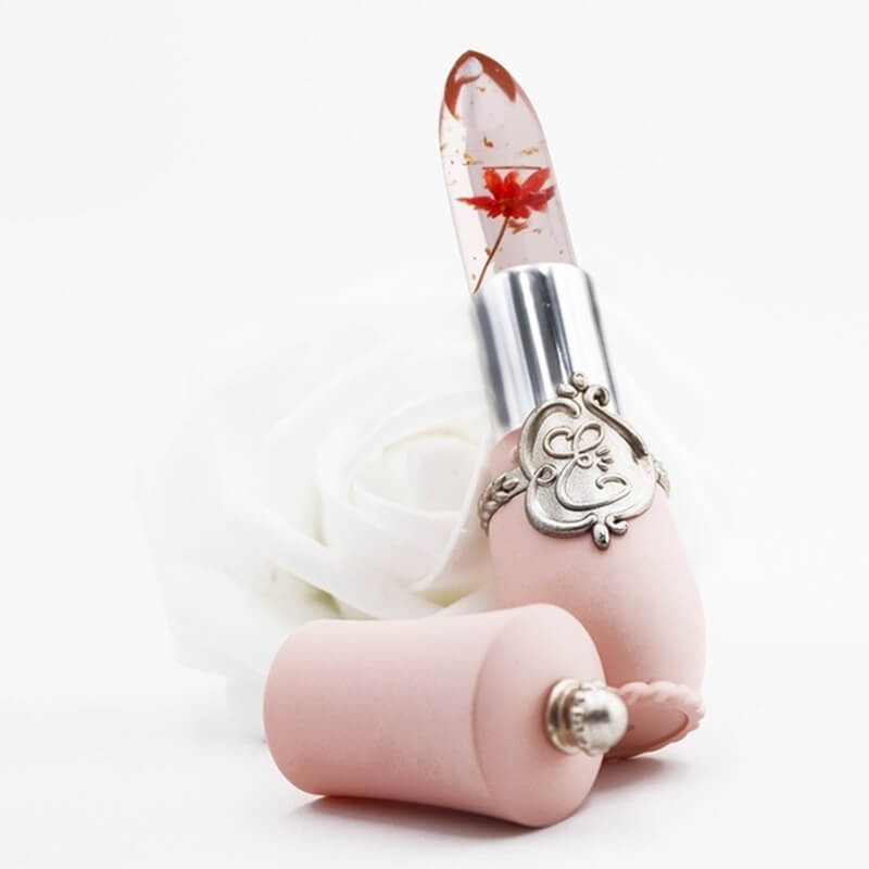 Blomster Gel Leppestift med en delikat blomst i bakgrunnen, symboliserer naturlighet & pleie