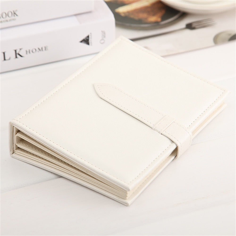 Flott gave: Bokformet smykkeholder for smykkeorganisering, øredobber og ringer. Elegant design.