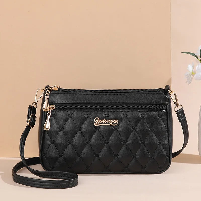 Stilfull brodert PU-skinn crossbody-veske, elegant og moderne dameveske med fine detaljer.