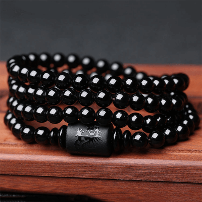 Pararmbånd drage og føniks, unisex i vulkansk glass og stein, symboliserer harmoni og styrke.