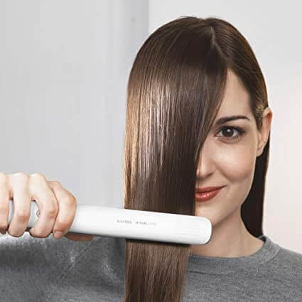 Hvit 2-i-1 hårjern for effektiv hårstyling. Rett hår eller lag vakre krøller med letthet.