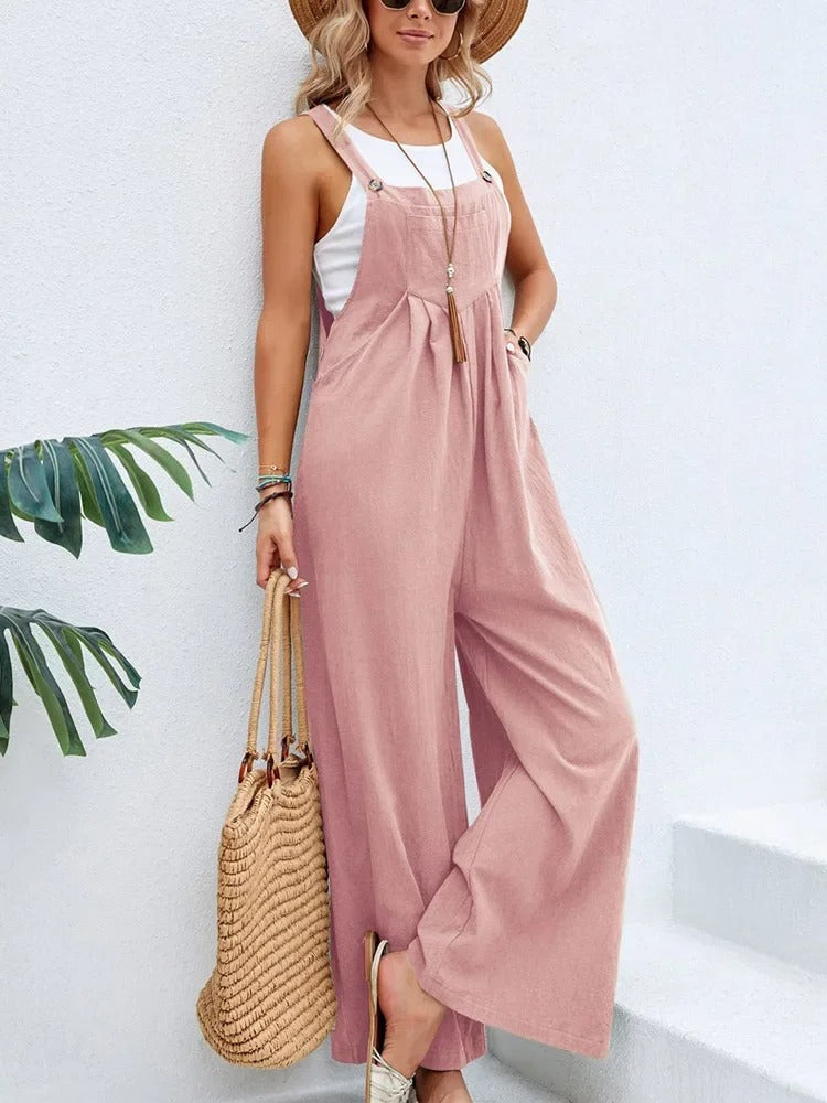 Avslappet baggy bib jumpsuit for kvinner med moderne brede ben. Superkomfortabel hverdagskjeledress.
