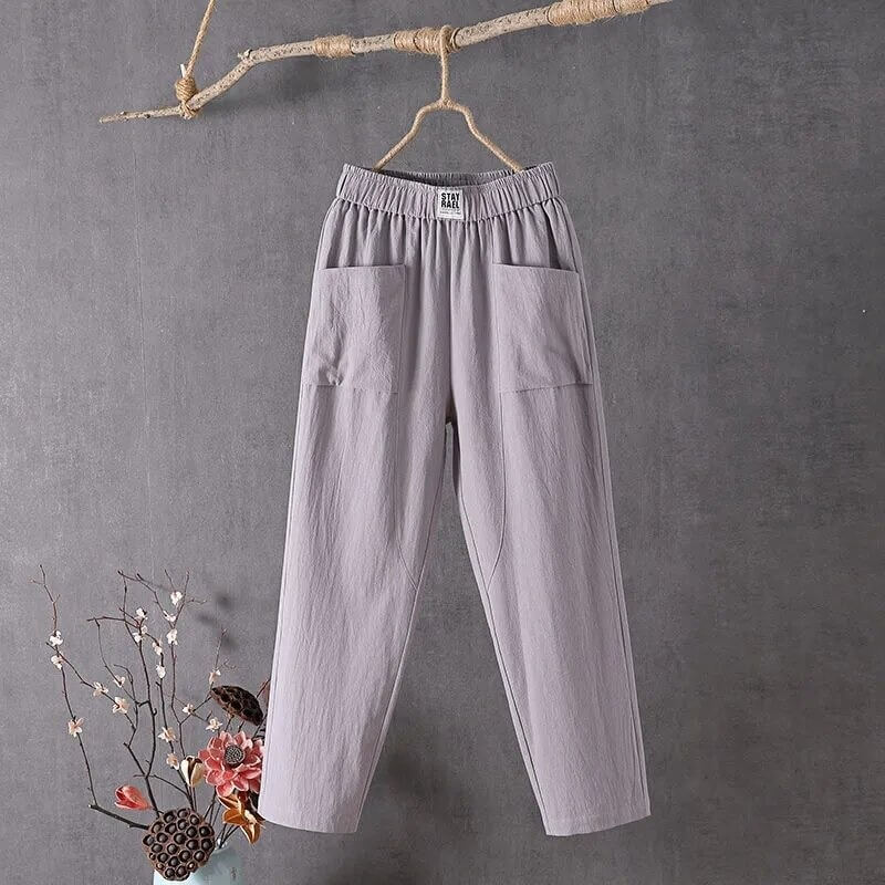 Ankellange damebukser med høy midje. Trendy baggy-passform i bomull for en casual, komfortabel og moderne look.