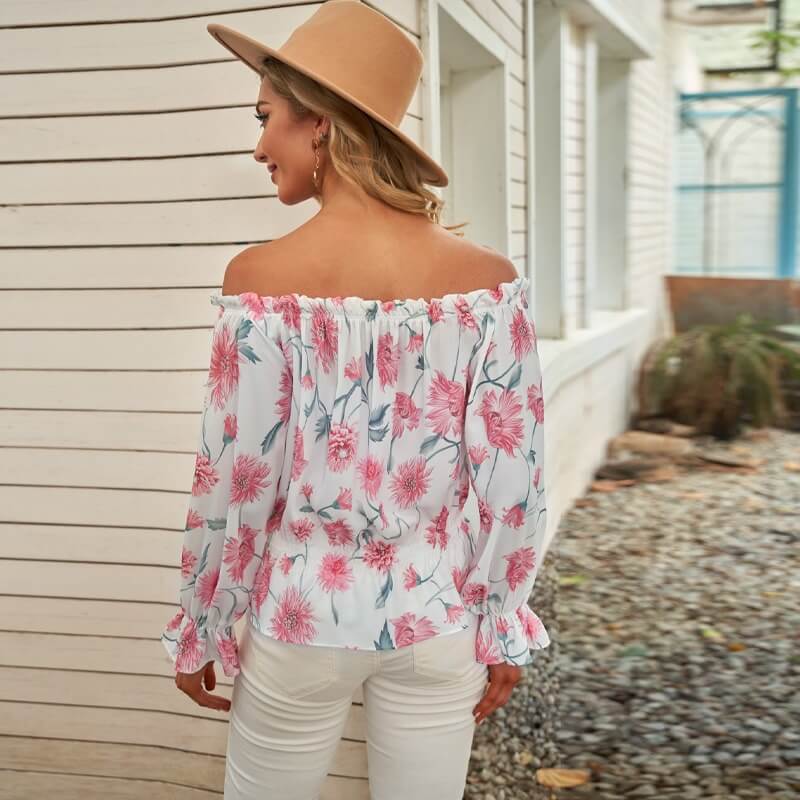 Blomstret damebluse med volanger, elegant og løs passform. Ideell for en chic hverdagsstil.