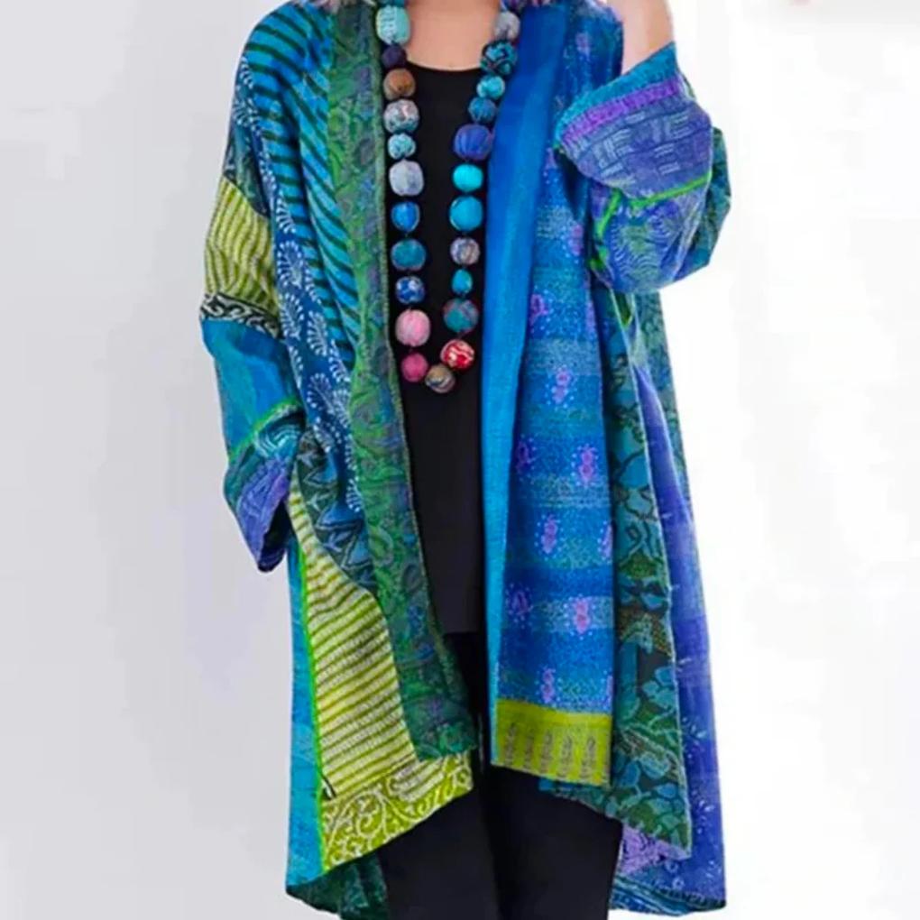 Dame cardigan i myk strikk, åpen front og sidelommer, perfekt for komfortabel hverdagsstil.