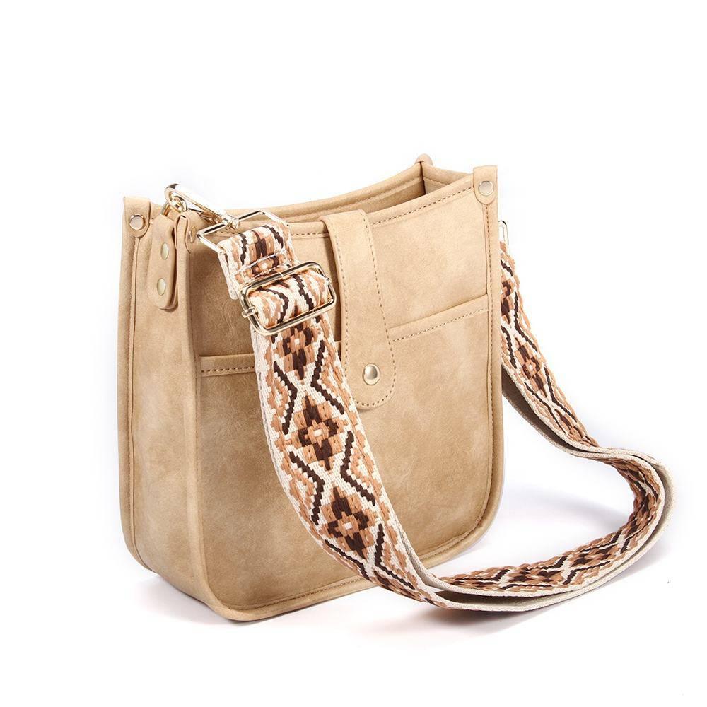 Elegant skulderveske i vegansk skinn for dame. Justerbar gitarsnor fremhever unik design.