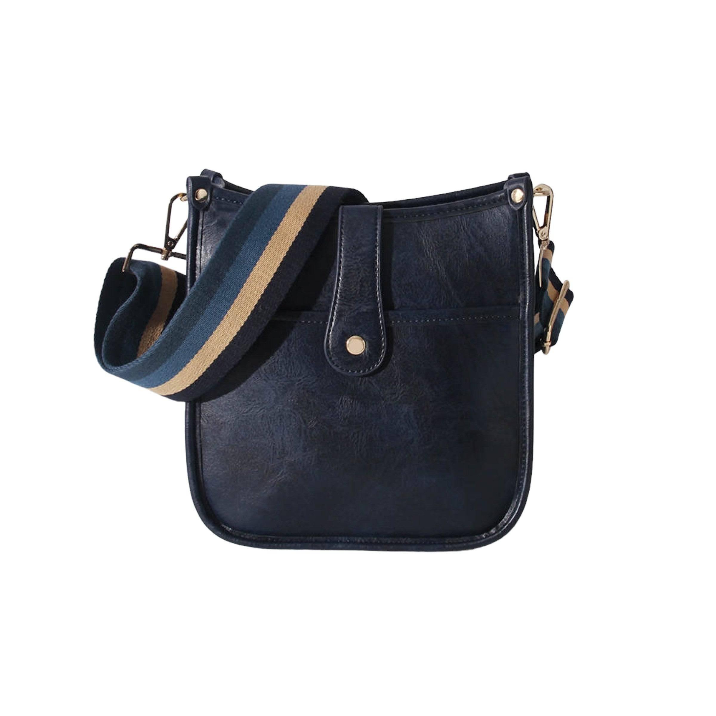Kompakt og stilig dame crossbody i vegansk skinn. Med justerbar gitarsnor for optimal passform.