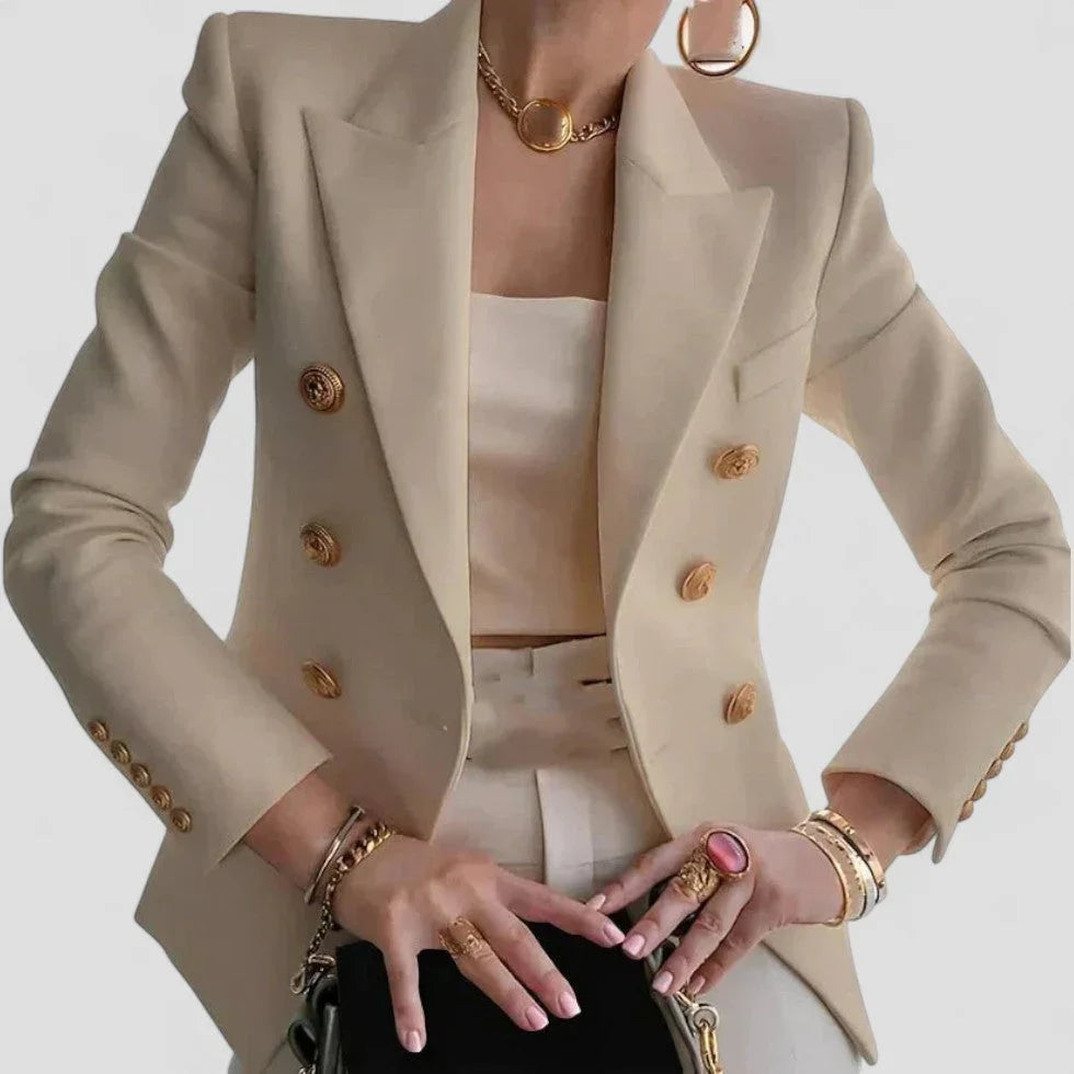 Stilig dobbeltspent dameblazer med markerte gullknapper, perfekt for en elegant kontorstil eller festantrekk.