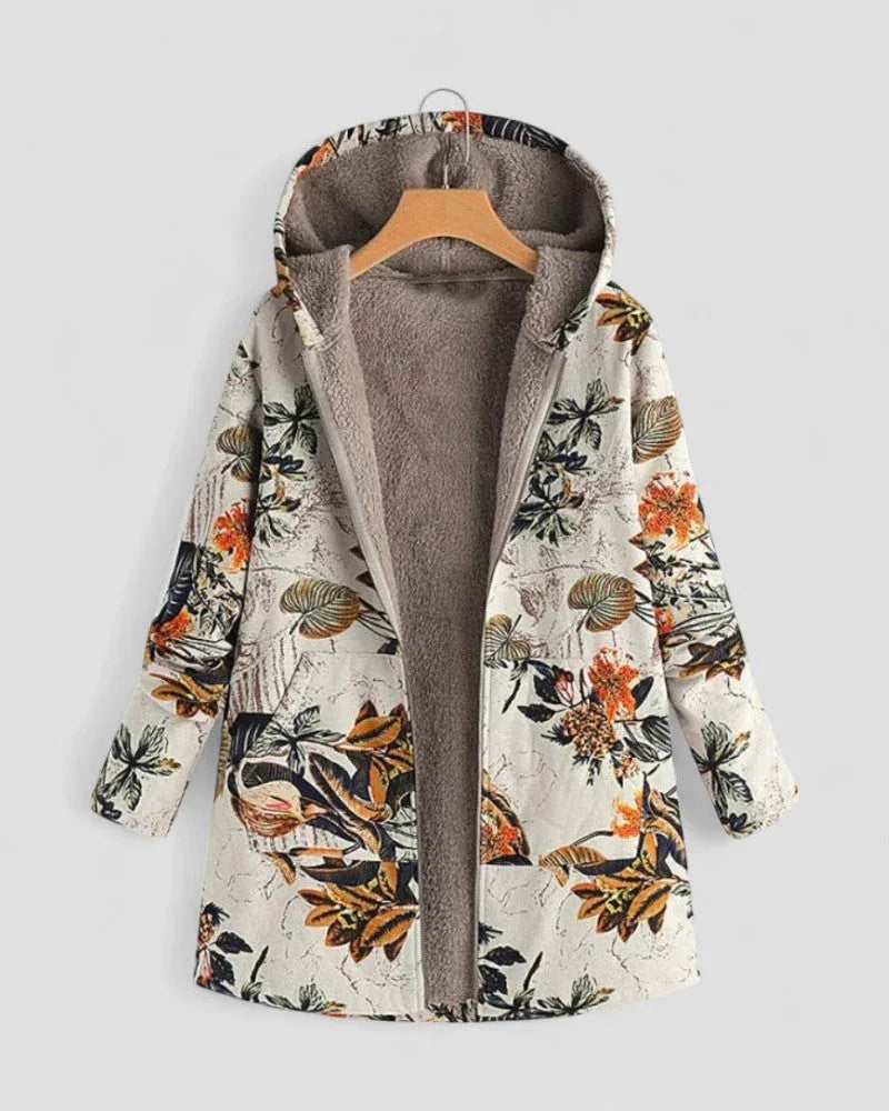 Komfortabel kvinners fleecejakke med hette, blomstermønster, perfekt for fritid og lagpålag.