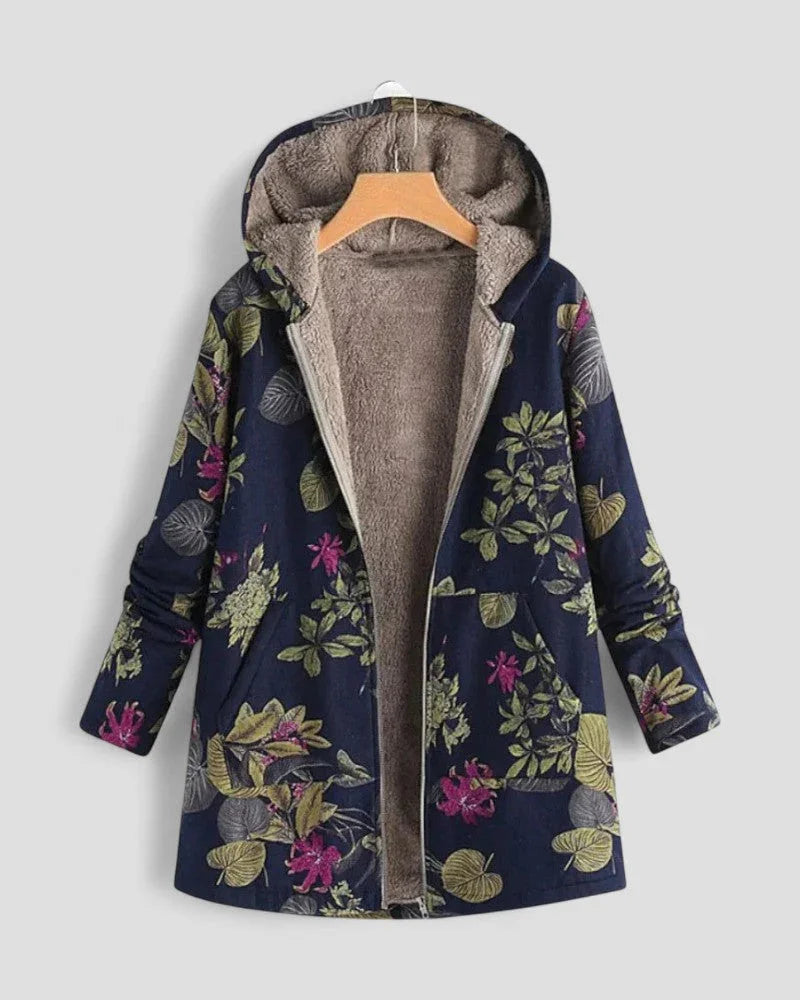 Stilig vårjakke i fleece til dame, med hette og trendy blomstermønster. Allsidig og myk.
