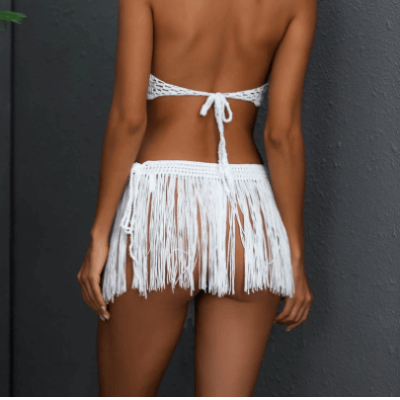 One size dame cover-up knyteskjørt med dusker, behagelig for varme sommerdager.