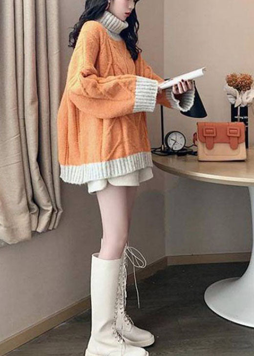 Komfortabel dame plus size skilpaddehals topp i patchwork. Varm langermet vintermote for kalde dager.