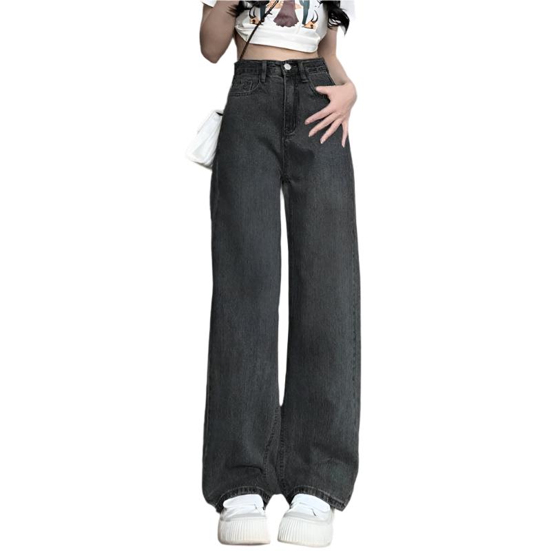 Blå denim vintage damejeans med vide ben og høy midje. Tidløs mote.