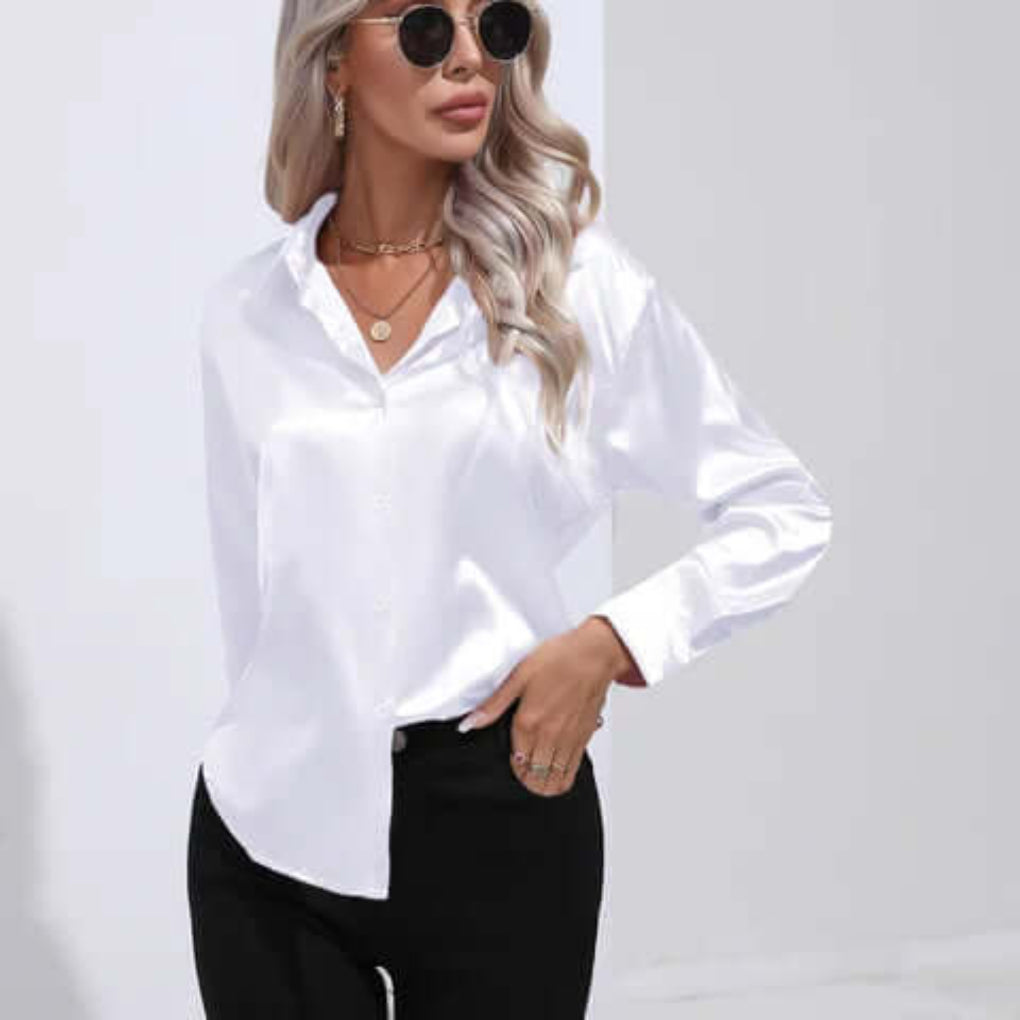 Hverdags elegant damebluse: lange ermer, løs passform. Komfortabel for en travel dag.