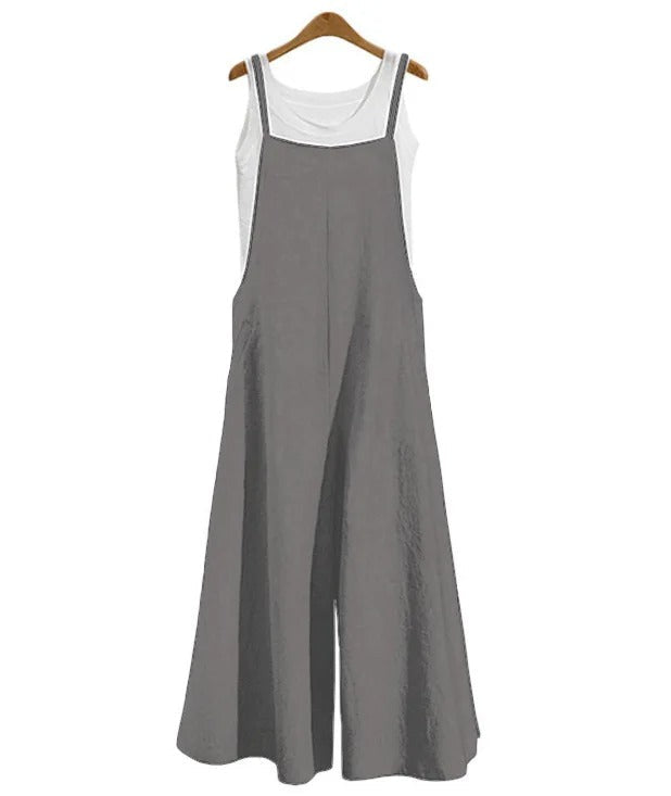 Ermeløs jumpsuit med løs passform og vide ben. Ideell for en avslappet og luftig sommerstil.