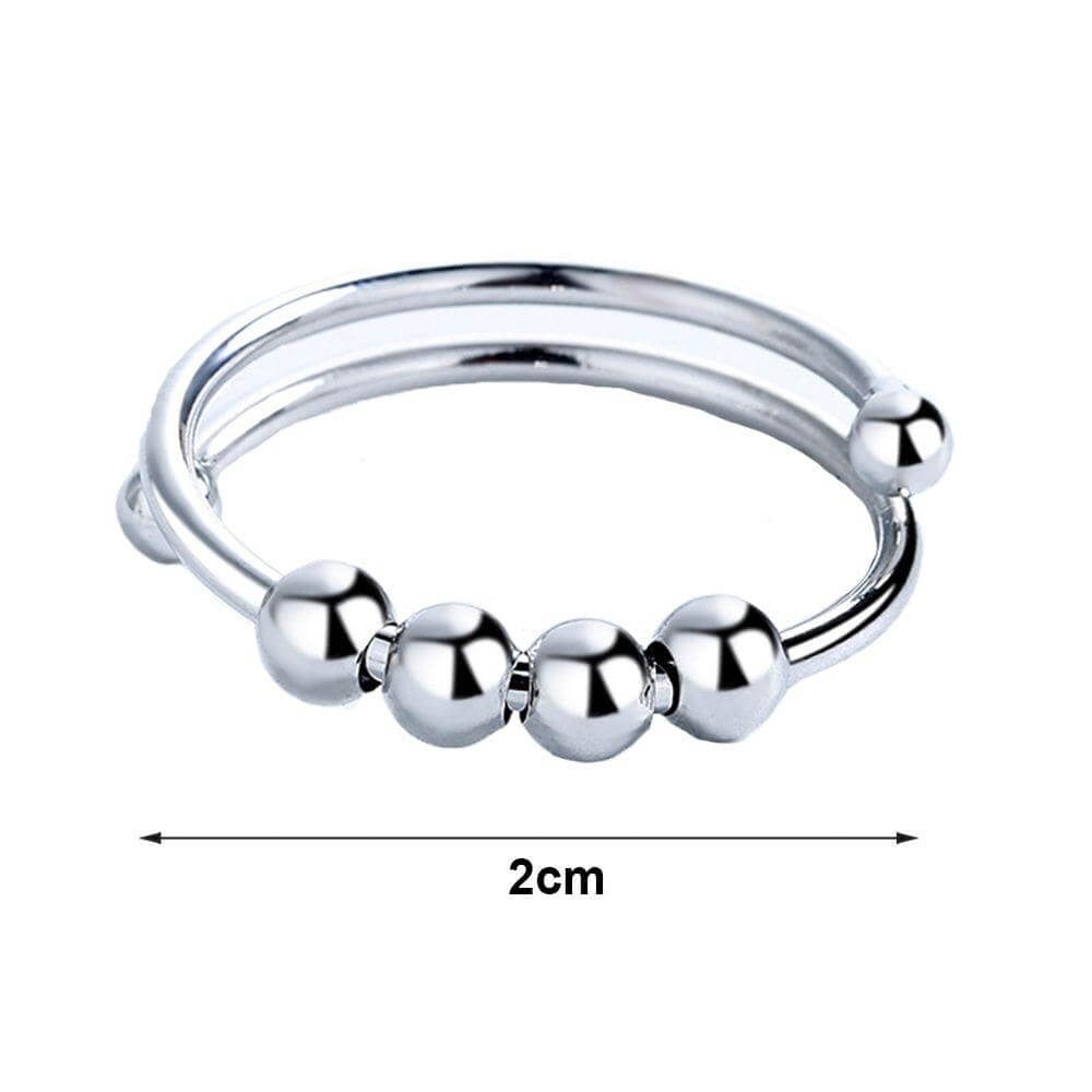 Produktansicht des Damen Fidget Rings: Drehbarer Anti-Stress-Schmuck mit polierten Perlen und glänzendem Metall.
