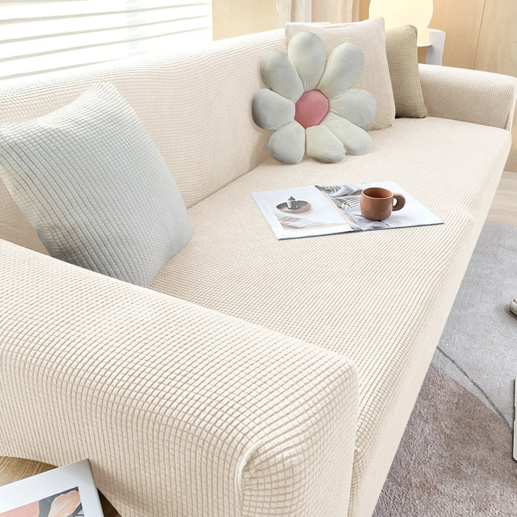 Elastisk sofatrekk i moderne grå, fornyer og beskytter din sofa med stil. Perfekt for stueinnredning.