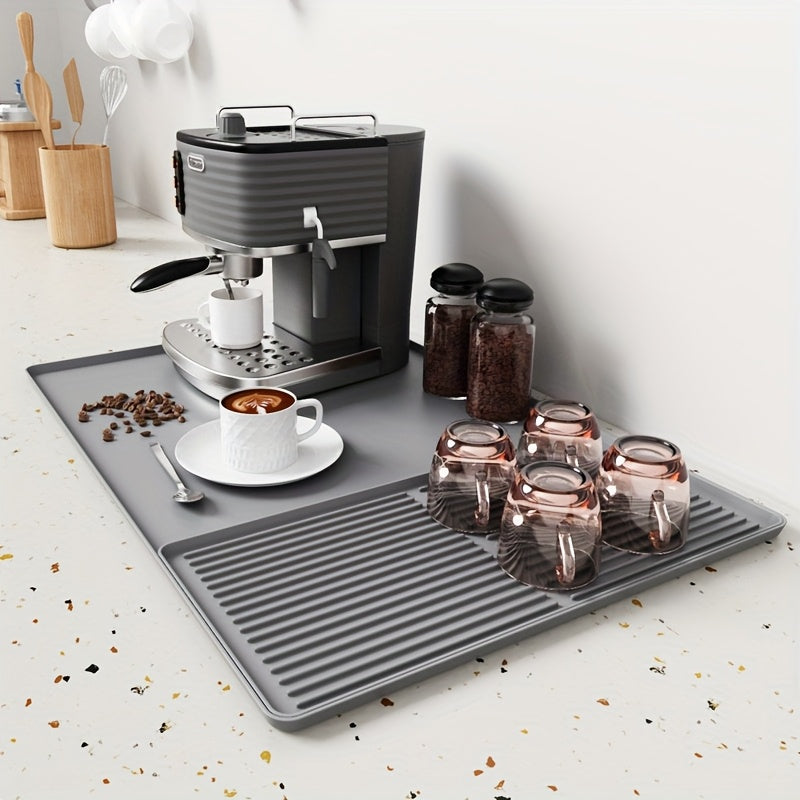 Praktisk silikon kaffematte med hevede kanter. Varmeresistent sølebeskytter til kjøkkenbenk.