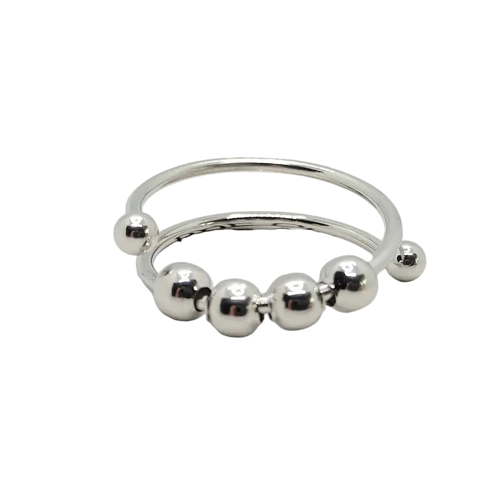 Elegant antistressring for kvinner, sølvfarget med roterende design, ideell for stressmestring og fokus. Beroligende smykke.