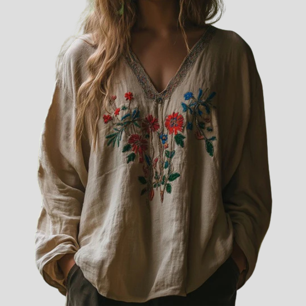 Elegant brodert bluse for kvinner, langermet og mønstret, perfekt for hverdag og fest.