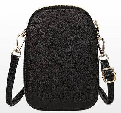 Kompakt vegansk lær crossbody skulderveske for kvinner. Stilfull og praktisk hverdagsveske.