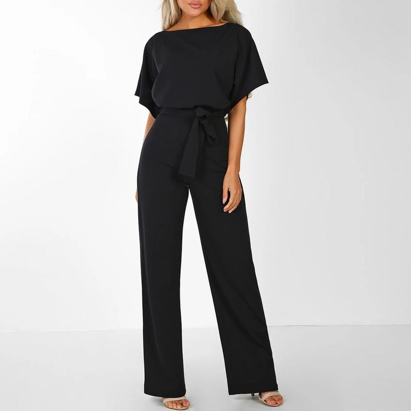 Komfortabel dame jumpsuit i helfigur, med justerbar snøremidje og flytende vide ben.