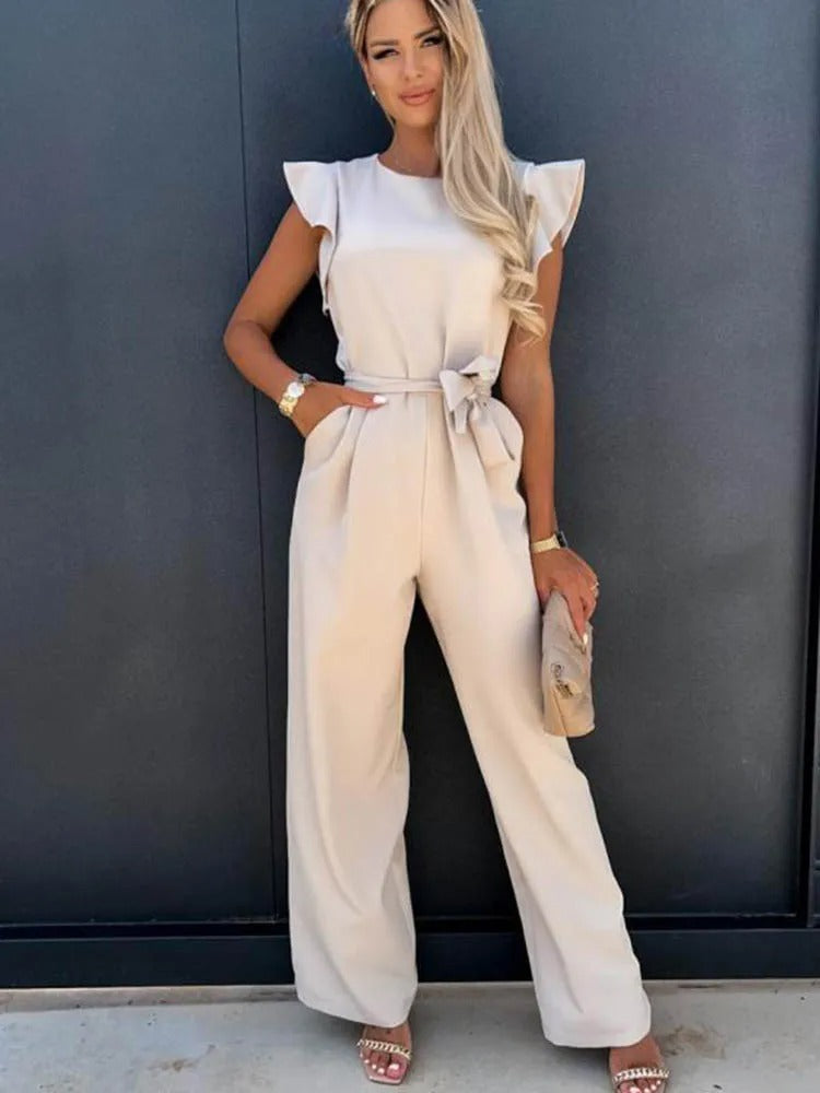 Dame jumpsuit i tidløst design, med volangermer og et smigrende midjebånd.