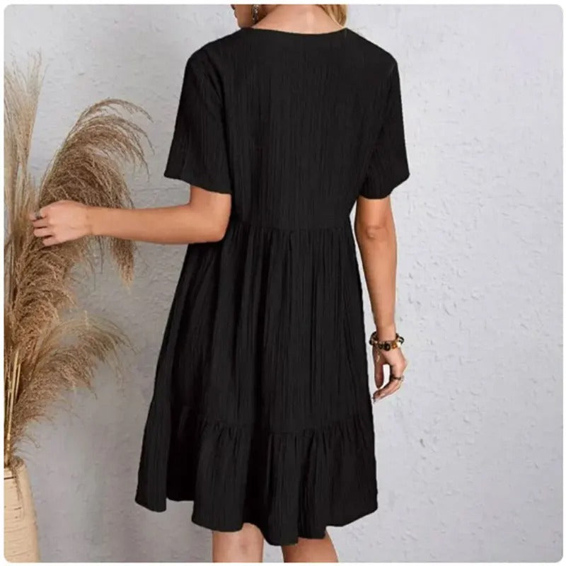 Allsidig Dame Peplum V-hals kjole. Kan styles til både fest og hverdag, med flatterende fit & flare.