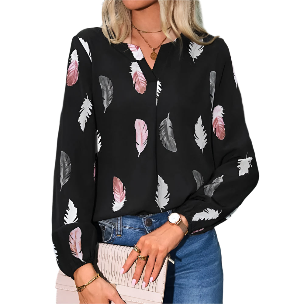 Klassisk damebluse med delikat fjærmønster. En allsidig og elegant topp for enhver anledning.