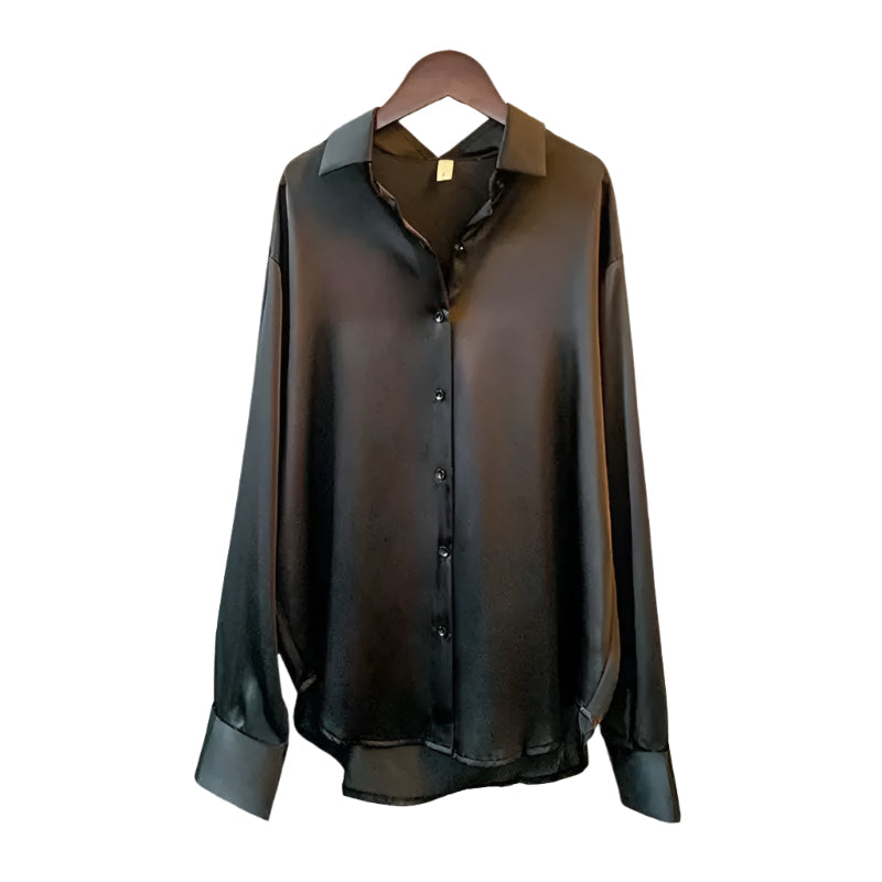 Allsidig damebluse med knapper, egnet for både formelle og uformelle anledninger. Tidløs stil.