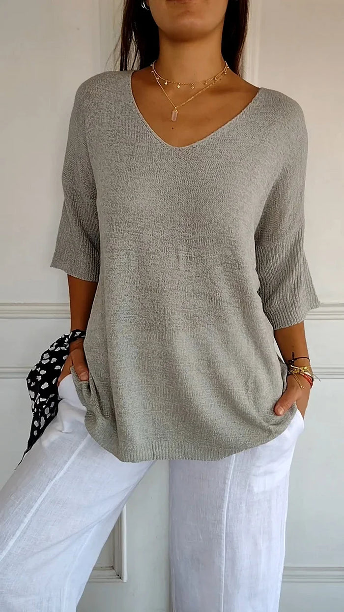 Rosa V-hals damebluse, elegant og komfortabel. Perfekt festtopp eller fritidsbluse for kvinner.