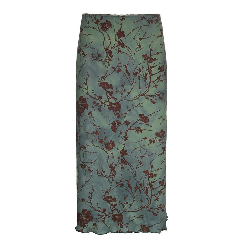 Retroinspirert midiskjørt for dame med fargerikt vintage blomstertrykk; elegant for sommer og vår.