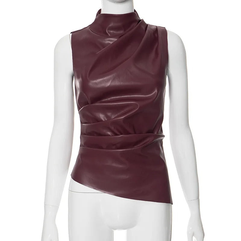 Allsidig ermeløs topp med høy hals. Elegant svart bluse som passer til mange antrekk.