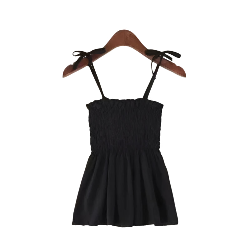 Elegant halterneck topp for kvinner med plissert front og stilig ryggfri design. Perfekt for fest.