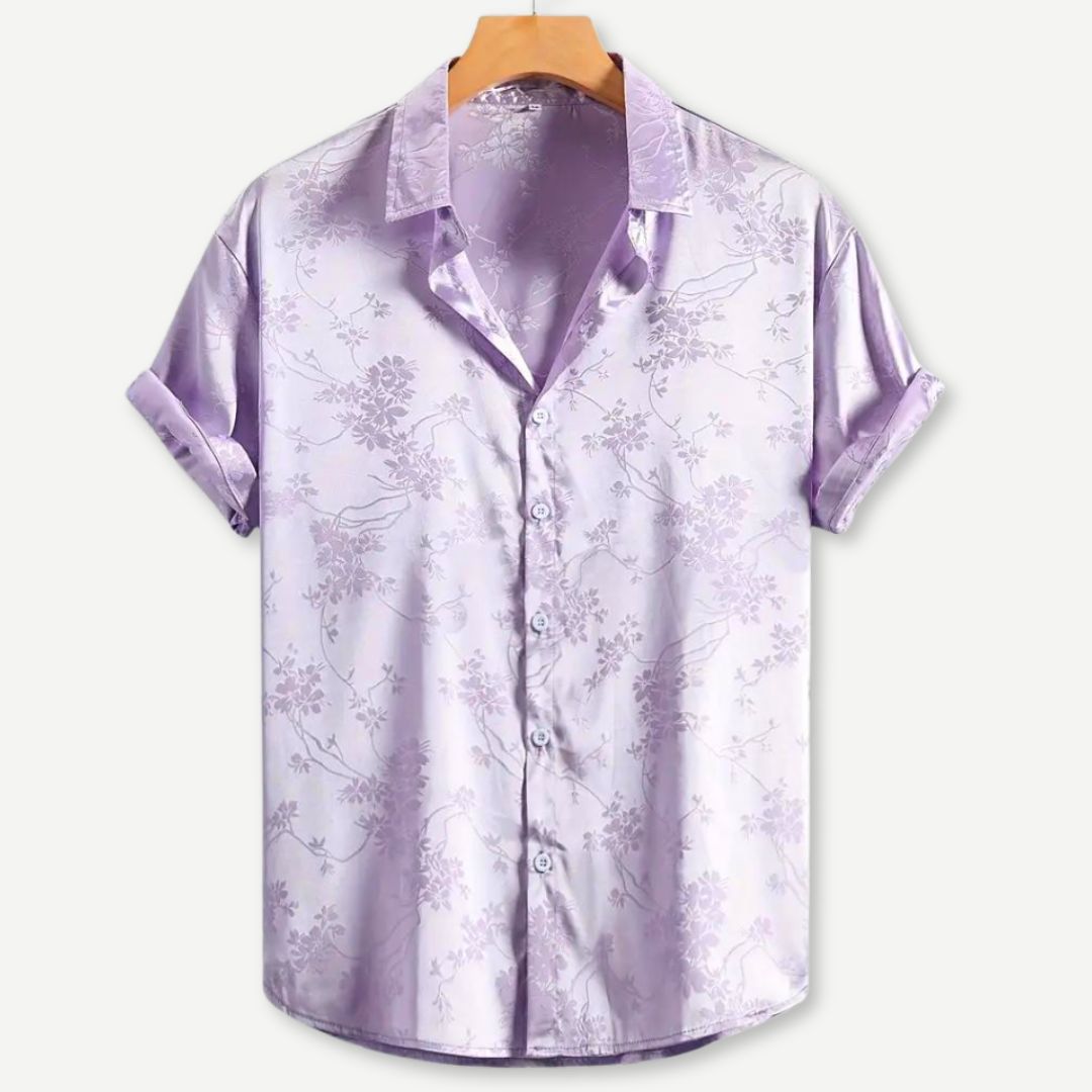Stilfull svart herreskjorte med lilla og grønn brodert blomsterdesign. Komfortabel bomull for vår og sommer.